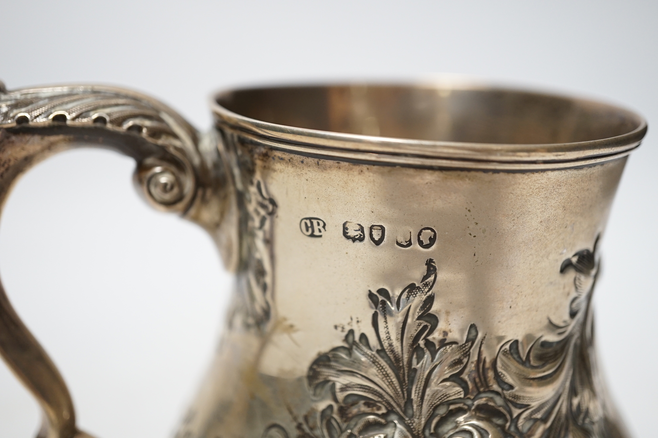 A Victorian embossed silver baluster mug, Charles Boyton II, London, 1866?, height 13cm, 8.6oz.